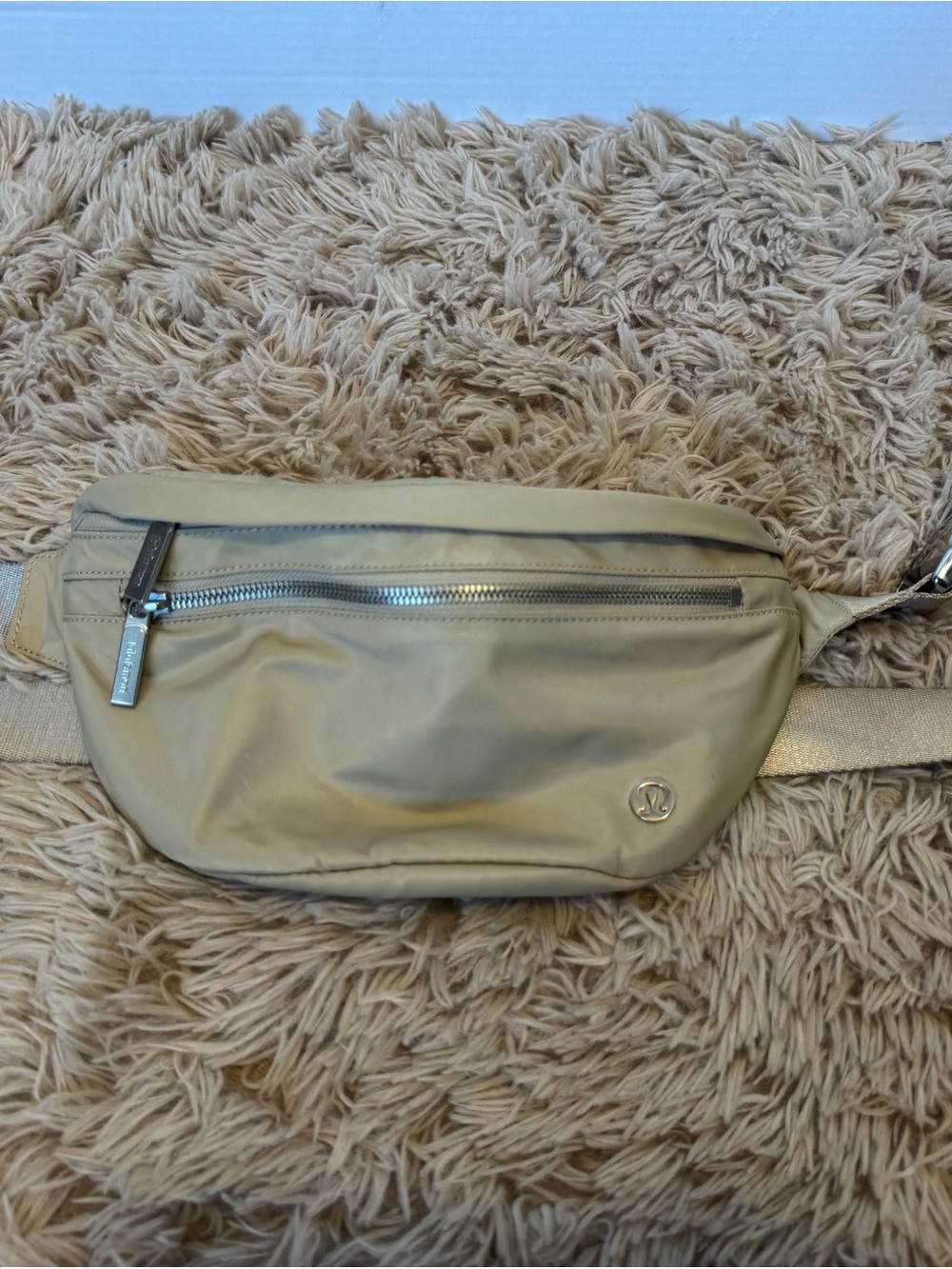 lululemon athletica beige belt bag with front zip pocket
